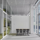Extra high glass wall with double glazing and steel panels