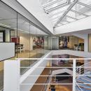 Main stairway with a full glass fire resistant glass wall with IE60 certification
