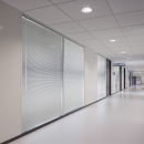Blinds between the glass in a partition with glass and steel panels 