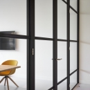 Double doors in a classic industrial glass wall