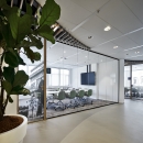 Single glass partitions wall combined with wood door frames
