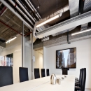 Inside a meeting room with glass partition wall and sliding door