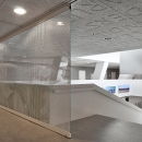 Full glass large sliding door at stair case at Leiden University College The Hague