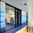 Glass partition wall with 1½ double doors