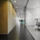 Corridor with on the right side IQ-Structural glass system wall with seamless panel joins.