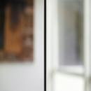 A glass to glass join (without mullions) of a fire resistant glass wall