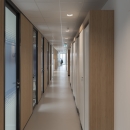 Corridor with closed partition and aluminum framed doors