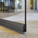 Glass door with dropseal to reduce sound under the door