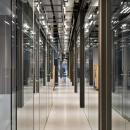 Corridor with glass partition walls of QbiQ