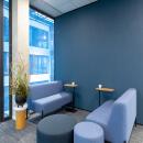 Conversation place in front of a partition with plasterboard with wallpaper
