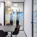 Meeting room with glass and closed wall parts at Novo Nordisk Alphen aan den Rijn