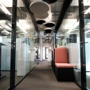 Hallway with glass partitions on both sides