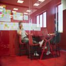 Conversation in a QQ1 freestanding glass office box at DBD Oirschot