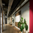 Offices with barn doors and glass partitions.