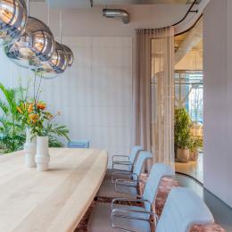 Inside a meeting room with curved glass partition