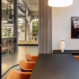 Inside a meeting room with curved glass partition