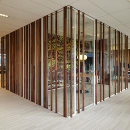 Wood construction on the glass of a office partition