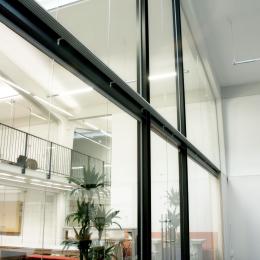 Extra high arc shape glass wall with steel construction and double doors