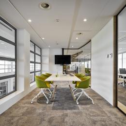 Conversation room with glass partition wall and closed elements