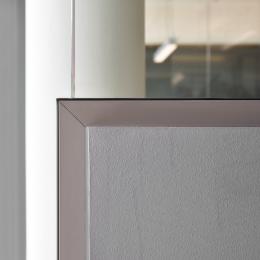 Corder detail of a partial glass and partial closed wall