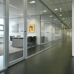 Corridor with double glass partition wall and framed doors
