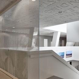 Full glass large sliding door at stair case at Leiden University College The Hague