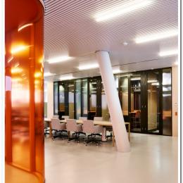 Curved glass partition wall with pink film