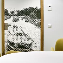 Oval conversation room made of single glass and closed panels