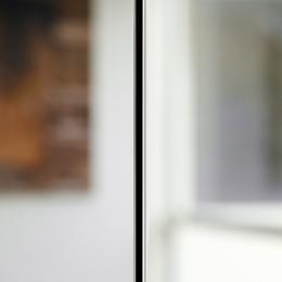 A glass to glass join (without mullions) of a fire resistant glass wall