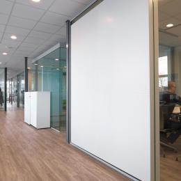 Acoustic panels glued ont the glass partition