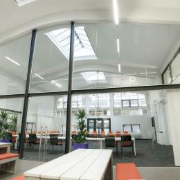 Extra high arc shape glass wall with double doors