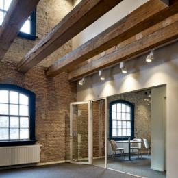 Modern glass wall combined with old stone walls