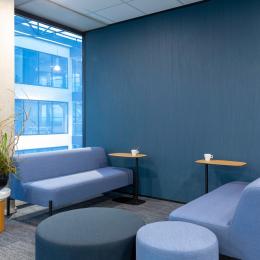 Conversation place in front of a partition with plasterboard with wallpaper
