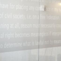 Text design on a full glass demountable wall