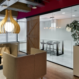Glass conversation room with barn doors.
