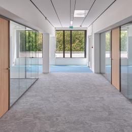 Corridor with glass partitions on both sides