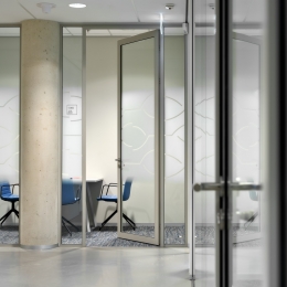 Aluminum framed door in glass partition
