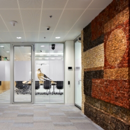 Double walled glass partition with flush door