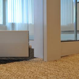 Drop seal under a tempered glass door