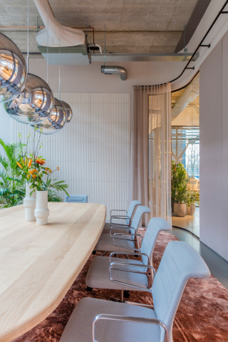 Inside a meeting room with curved glass partition