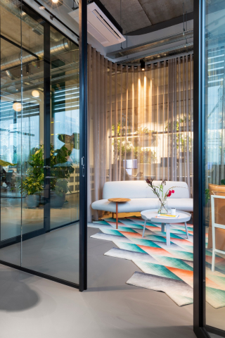 Meeting room with the dooor open made of single glass