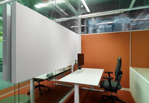 Acoustic panels glued on a glass wall to absorb the sound