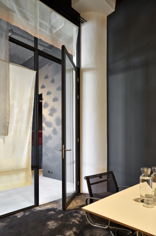 Modern industrial look wall with double glass and framed door