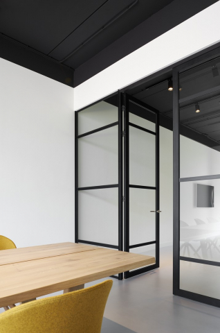 Double doors in a classic industrial glass wall