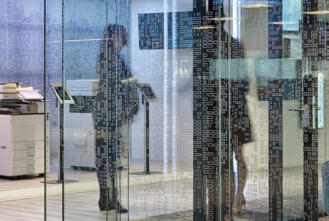 Vector pattern foil added to glass of a demountable office wall