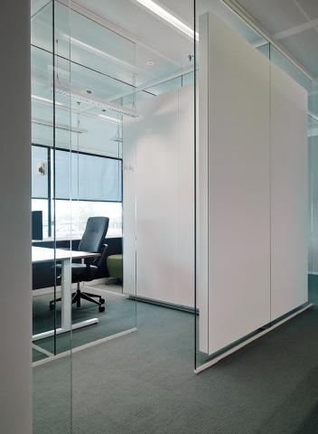 iQ Mute sound absorbing  panels glued ont a glass wall to absorb the sound