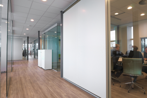 Acoustic panels glued ont the glass partition