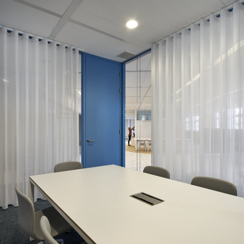 The inside of a conversation room made of doubel glass.