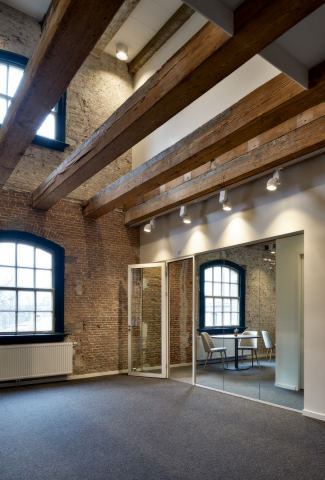Modern glass wall combined with old stone walls