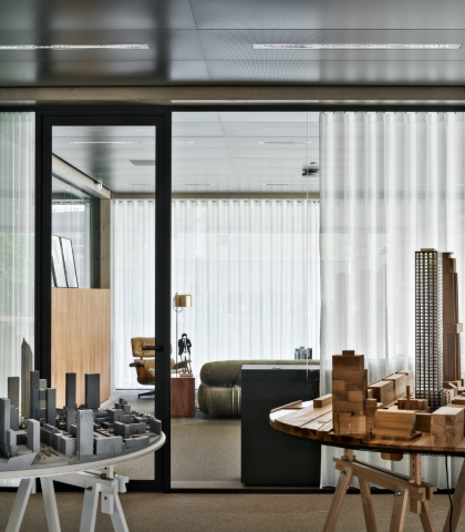 Glass partition with black profiles.